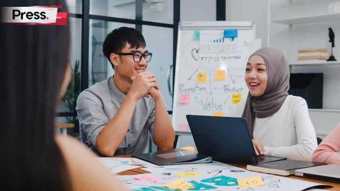 malaysian employees using their soft skills to communicate at work