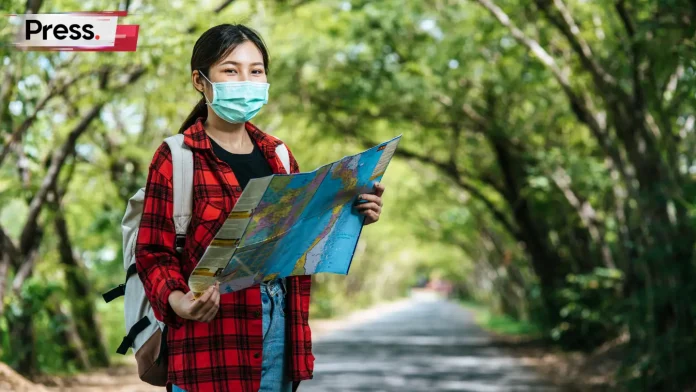 asian tourist guide holding a map in malaysia