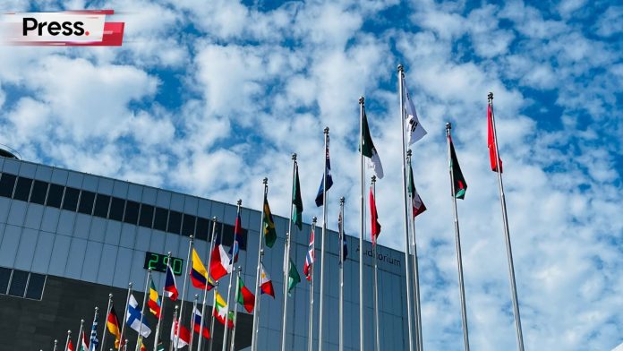 Several Countries flag rises high up on sunny sky