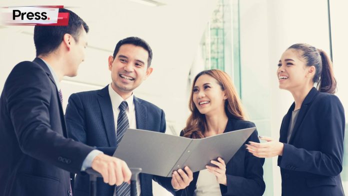 malaysian sales team discussing what to do with AI