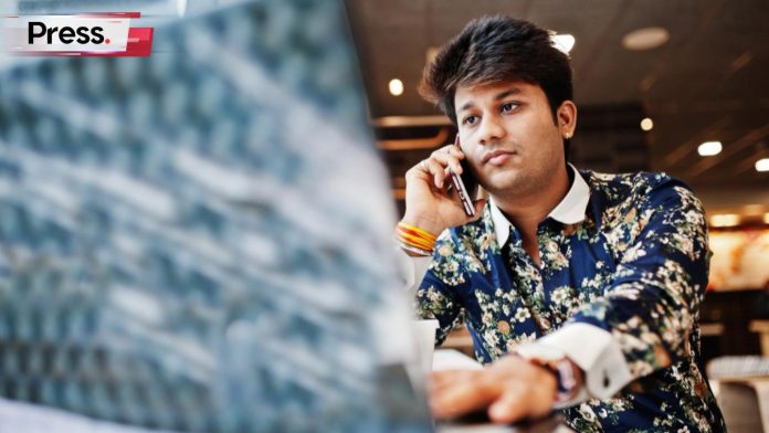 A freelancer works on his laptop, conducting local SEO in Malaysia.