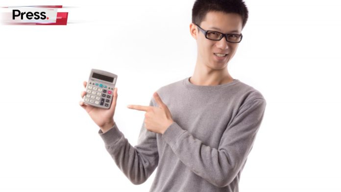 a man holds up a calculator and points to it, comparing the seo price in Malaysia