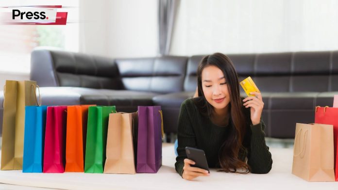 asian woman looking at a pricey shopping list on her phone