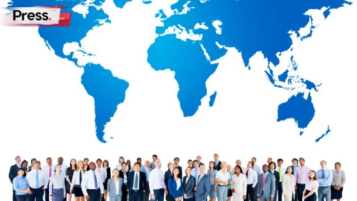 Photo of a diverse audience standing below a world map, symbolizing international SEO
