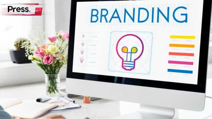 Image of a PC with the word 'branding' and a lightbulb symbol on the screen, symbolizing brand consistency.