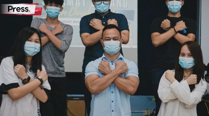 man in white button up shirt and woman in white sleeveless shirt