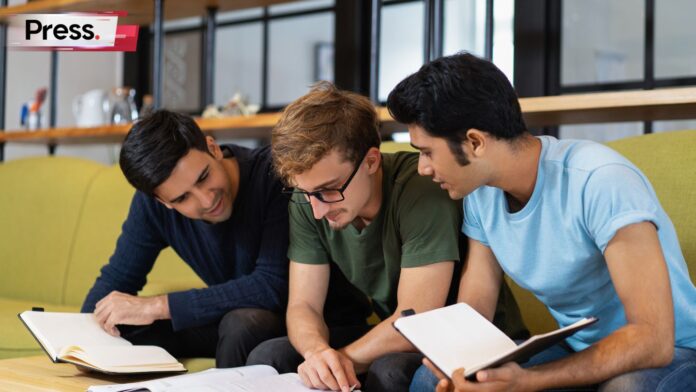 Three students discussing their MUET results