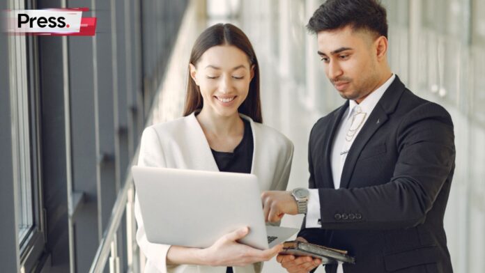 Businessman and businesswoman discussing paid up capital