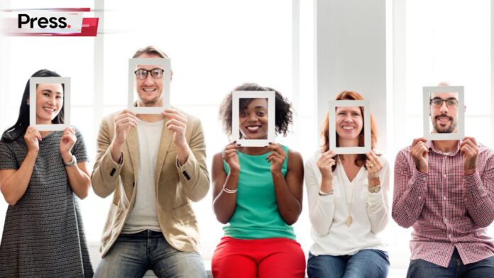 Photo of a group of people holding up frames in front of their faces, representing tests like the MBTI and SBTI test.