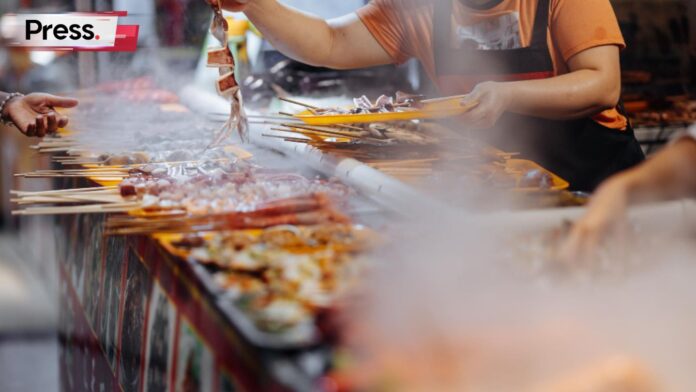 Photo of a local business in Malaysia, a satay stall, representing one amongst many local businesses