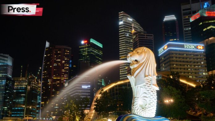 Photo of Singapore's office buildings and the merlion at night, symbolizing Singapore job opportunities