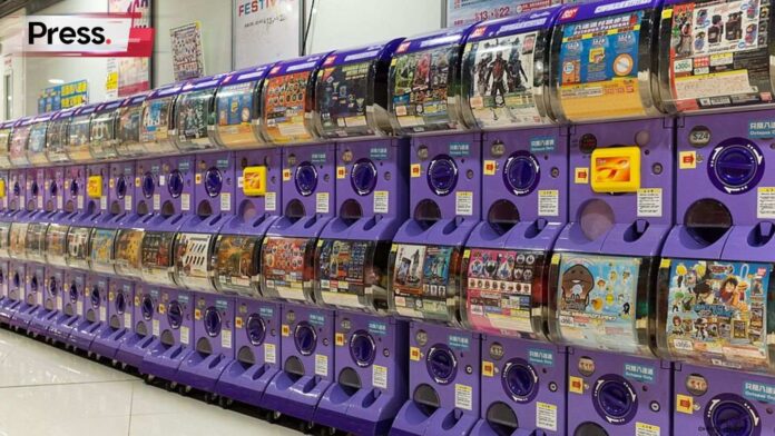Photo of gachapon machines, representing gacha games