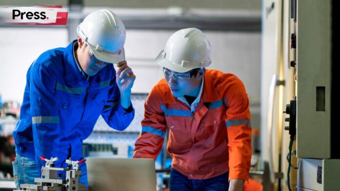 Photo of two engineers discussing something, representing engineer salary